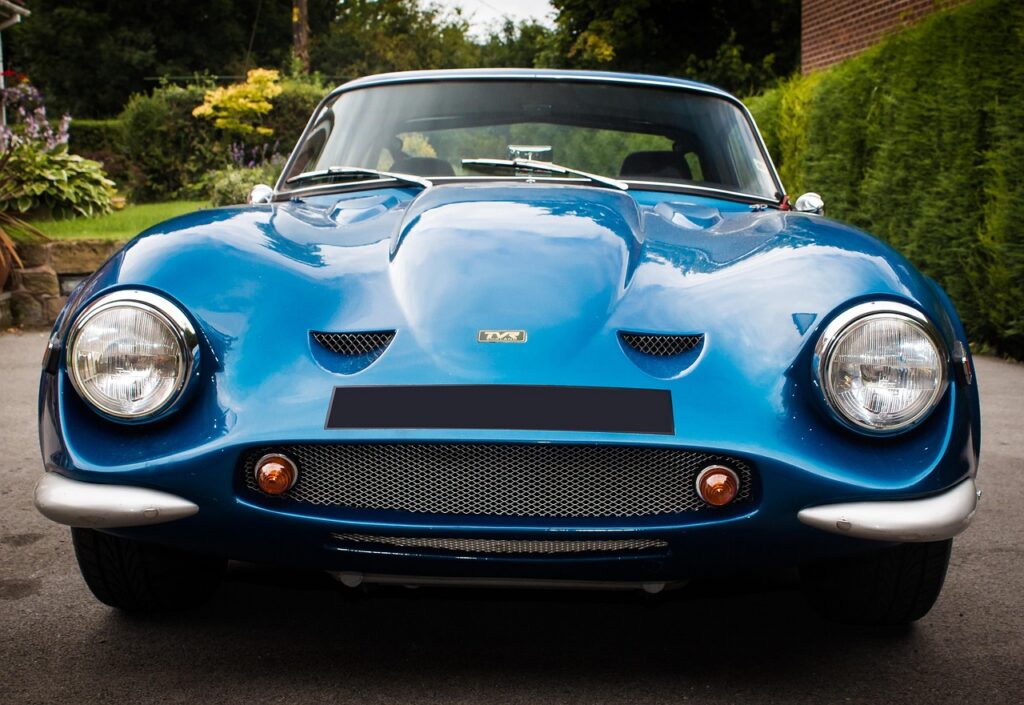 classic car, tvr, car, headlights, car photography, vintage sports car, vintage, grill, hood, bonnet, pov, depth of field, transportation, photography, auto, drive, driving, car wallpapers, vehicle, blur, green, outdoors, bumper, new, shine, fast, automotive photography, car photo, fast car