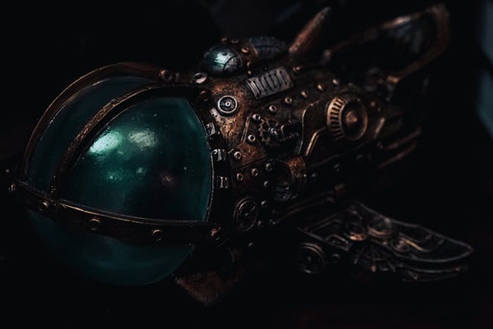 Close-up of a detailed steampunk miniature submarine model with brass gears and glass dome.