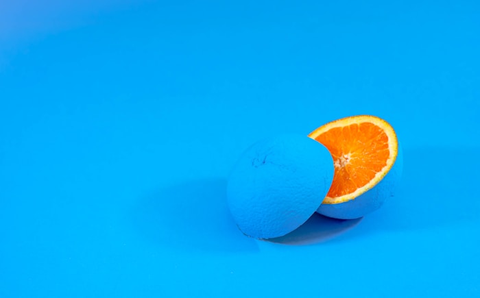 orange fruit on blue surface