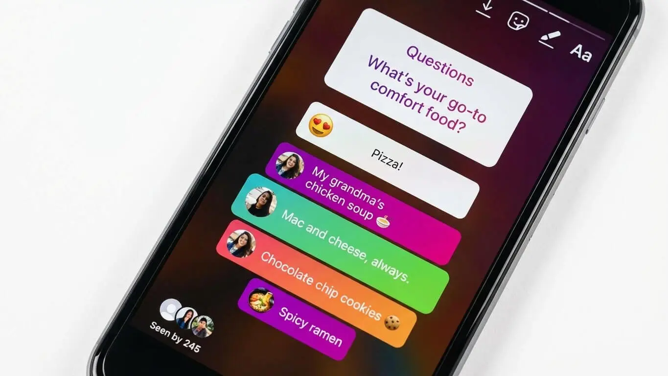 A smartphone screen displays an Instagram story Q&A asking What's your go-to comfort food?—a great example of Instagram Stories engagement—with responses like pizza, chicken soup, mac and cheese, chocolate chip cookies, and spicy ramen. Uploaded on aifreeforever.com