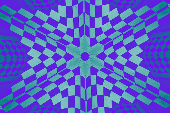 A geometric pattern features a symmetrical flower shape.