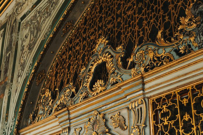 a close up of a gold and blue wall