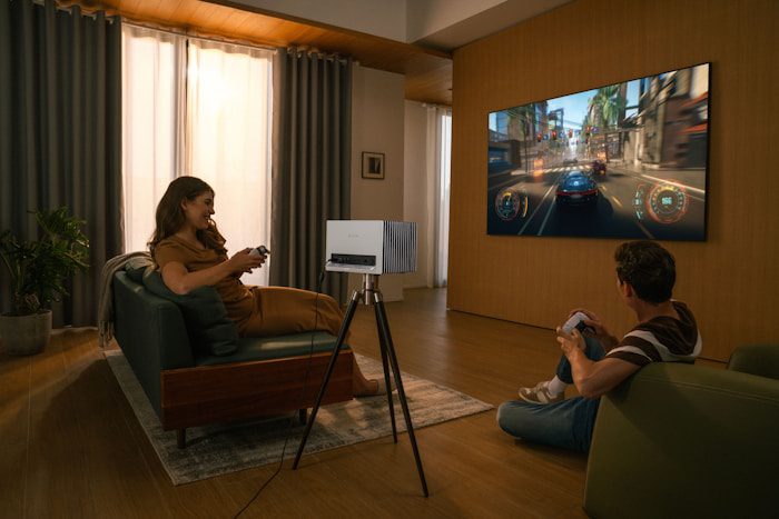 People enjoy gaming on a projected screen.