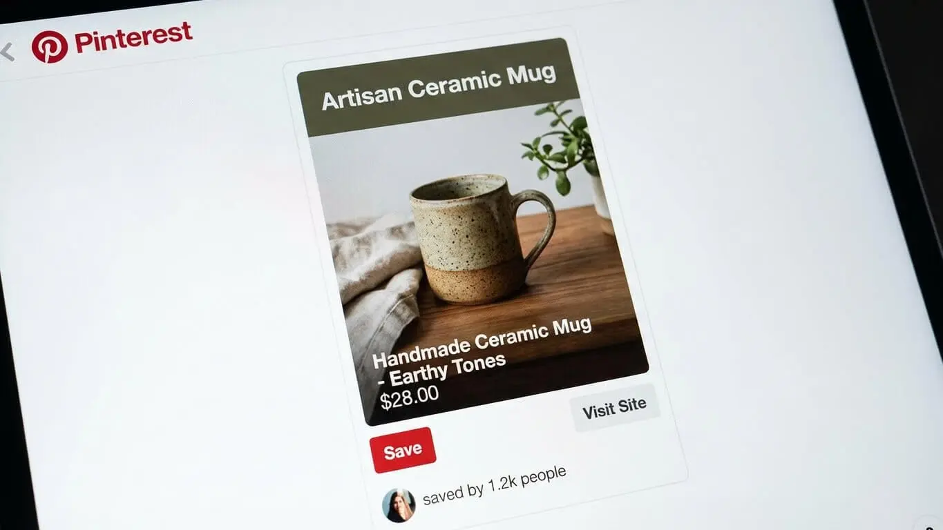A Pinterest post displays an artisan ceramic mug on a wooden surface with text listing it as a handmade mug in earthy tones for $28.00, showcasing a smart Pinterest strategy to boost website traffic. Uploaded on aifreeforever.com