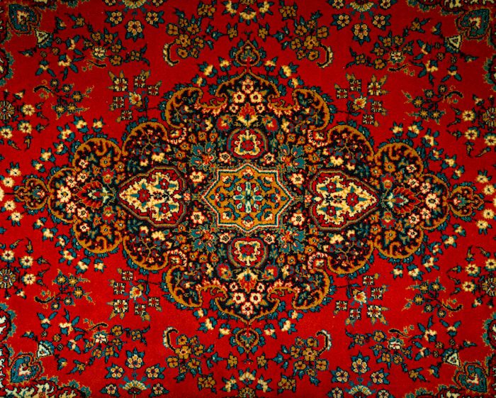 a red carpet with a colorful design on it